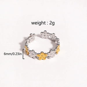 Detail view of two-tone daisy ring showing 6mm width and 2g weight measurements