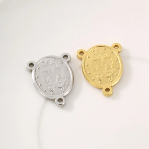 Detailed macro view of gold and silver stainless steel triple-hole goddess connectors