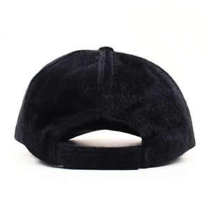 Rear view of black plush faux fur baseball cap for women with fuzzy texture detail