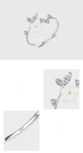 Detail of S925 sterling silver ring showing shell flower and hand-set zircon stones