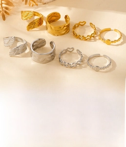 Detail view of 8-piece titanium steel ring set with hollow hearts and angel wings