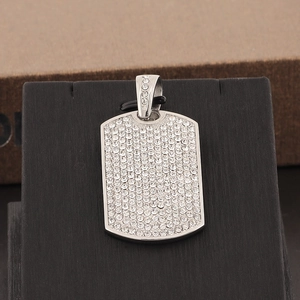 Close-up of hip hop square dog tag pendant with full diamond pavé on black stand