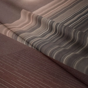 Macro shot of abstract wavy textile fabric with deep coffee and beige silk texture