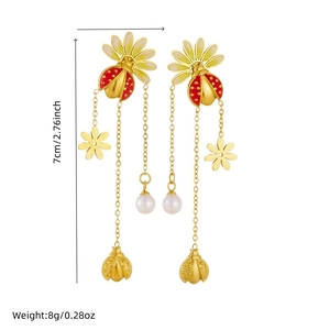 Gold stainless steel tassel earrings featuring ladybug, daisy flower and pearl charms