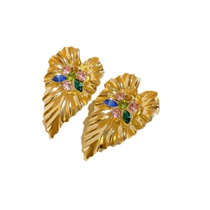 Vintage gold leaf-shaped earrings with colorful gemstones and textured metal finish