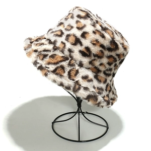 Close-up of fluffy leopard print faux fur texture on a stylish autumn winter bucket hat