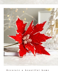 Detail of red velvet poinsettia with white glitter snow edges for Christmas tree decor