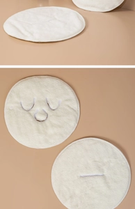 Close-up of thick microfiber hot compress face mask towel showing soft velvet texture