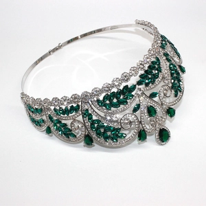 Detailed view of silver bridal crown with sparkling green and clear teardrop gemstones