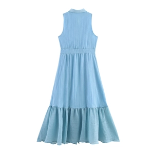 Elegant light blue sleeveless shirt dress with textured fabric and ruffled hem