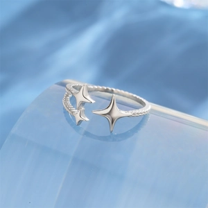 Macro shot of silver S925 star ring with twisted texture and polished surface
