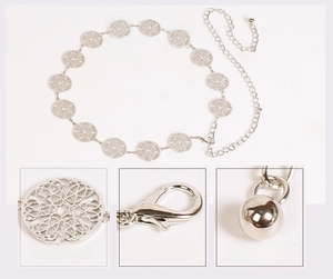 Detail of silver metal waist chain with hollow circle patterns and a lobster clasp closure
