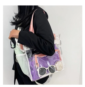 Model showing pink transparent PVC tote bag with white mesh side pocket and large capacity
