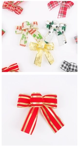 Close-up of 5cm wide festive Christmas bows with varied patterns for tree decoration