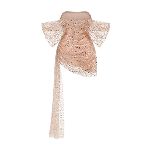 Detailed view of champagne gold sequin cocktail dress with side ribbon and bow sleeves