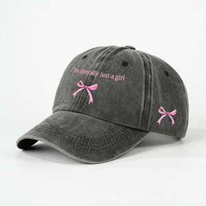 Washed dark grey baseball cap with pink I'm literally just a girl text and bow embroidery