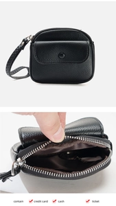 Close-up of black lychee grain mini coin purse with card slots and wrist strap details