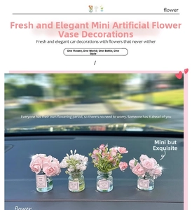 Miniature glass vase set with pink jasmine flowers and Good Luck label for car interior