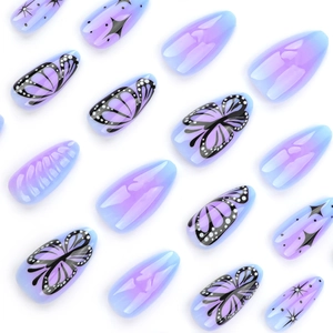 Short almond press-on nails with blue-purple gradient, butterfly and star patterns