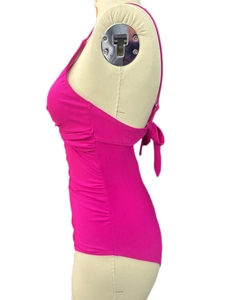 Detail of rose red one-piece swimsuit featuring side ruching and back lace-up closure