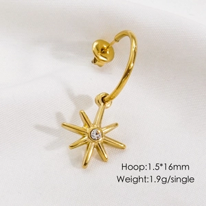 Detailed view of a gold-plated stainless steel hoop earring with a sparkling star pendant