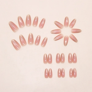 Detailed set of 24 almond cat-eye press-on nails with gradient nude shimmer and glossy finish