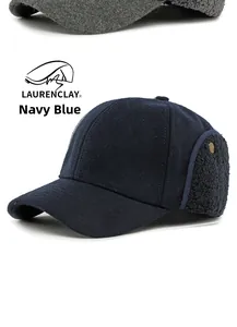 Detail of navy blue winter baseball cap with plush ear flaps and wool texture