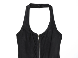 Detail of black denim halter dress featuring a silver metal zipper and workwear texture