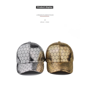 Detail showing metallic gold and silver baseball caps with hexagonal honeycomb texture