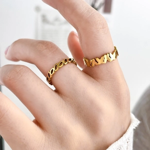 Golden butterfly pattern wide band and oval cutout ring set for women's hand
