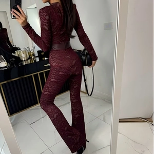 Rear view of burgundy lace jumpsuit showing back details and slim fit tailoring