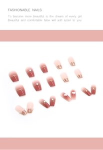 Detailed close-up of French blush gradient nails with 3D white hearts and red plaid pattern