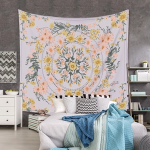 Detailed close-up of bohemian mandala tapestry featuring orange floral patterns on purple