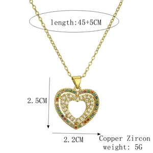 Close-up of heart pendant with colorful zircon stones and gold-plated copper chain