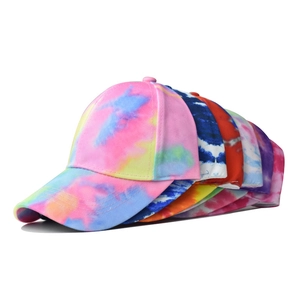 Colorful tie-dye cotton baseball caps with curved brims in various vibrant patterns
