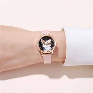 Close-up of pink leather watch with cute cat ear case and rose gold roman numerals