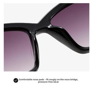 Close-up of smooth integrated nose pads on black square frame sunglasses with purple lenses