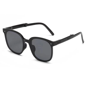Foldable oversized sunglasses for women in glossy black frame with dark grey lenses