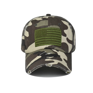 Detail of vintage washed camo baseball cap featuring olive USA flag patch and distressed brim