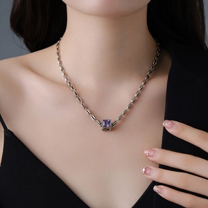 Close-up of vintage square purple gemstone pendant necklace on model neck
