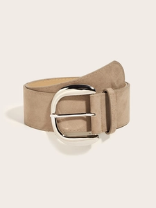 Macro detail of wide khaki suede belt featuring a polished silver metallic D-ring buckle