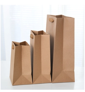 Brown kraft paper gift bags in three sizes with matching handles for shopping