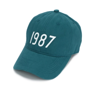 Detail view of the 1987 embroidery on the dark blue cotton twill baseball cap