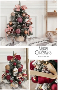 Mini tabletop Christmas tree set with pink and red baubles, pine cones and bows