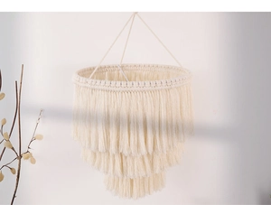 Detail of multi-layered cotton rope woven lampshade with long bohemian fringe texture