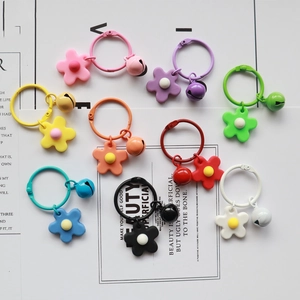 Colorful knitted flower bell keychains set in 9 vibrant candy colors with resin finish