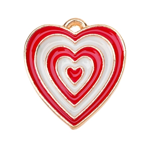 Macro shot of red and white striped enamel heart pendant with golden metal frame
