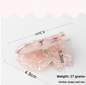 Pink pearlescent butterfly hair claw clip size details with dimensions 8.3cm by 5.3cm