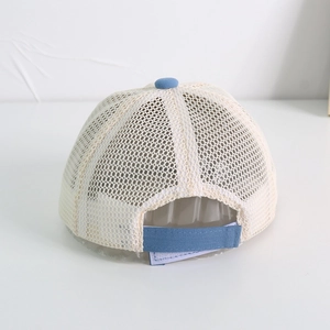 Detail view of the breathable beige mesh and adjustable blue velcro strap on the baby sun hat