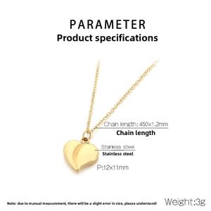 Macro detail of golden heart pendant showing 12x11mm dimensions and stainless steel texture